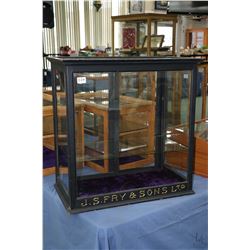 Antique counter top display cabinet with sliding glass doors and single shelf marked "J.S. Fry & Son