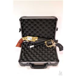 Small Safari foam lined hard case and two faux guns including single action revolver and Volcanic.