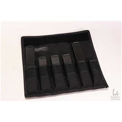 Nylon pouch with five 9mm stick magazines pinned to 5 rounds.