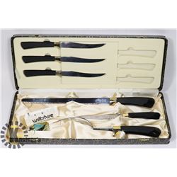 A BOX OF STEAK KNIVES