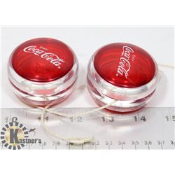 A PAIR OF VINTAGE COCA COLA YOYOS