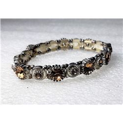 10)  SILVER TONE AND AMBER CRYSTAL