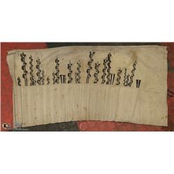LOT OF LARGE DRILL BITS IN ROLLUP CANVAS