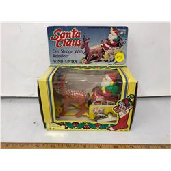 WIND-UP SANTA CLAUS ON SLED