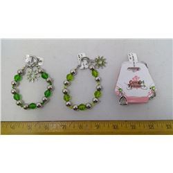 2 GREEN BRACELETS AND ONE PAIR OF STIRRUP EARRINGS W/ GREEN JEWELS
