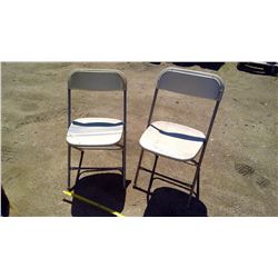 2 White Folding Chairs
