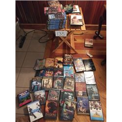 Folding Stand with approx 50 DVD's table 20"l x 18"w x 20"lt