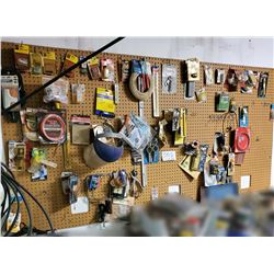 Peg Board Full of Assorted Hardware Items, Mostly New in Packaging