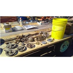 YELLOW PAIL OF OLD METAL+DOORKNOB, WIRE, HATCHET HEAD, CLOTHESLINE PULLIES, AND SPRINGS