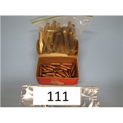 lot with 18 brass casings 7 mm and partial box 7 mm bullets