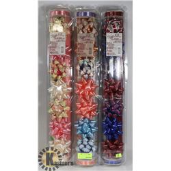 BUNDLE OF GIFT WRAP, BOWS, AND RIBBON