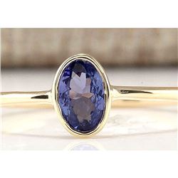 0.60 CTW Natural Tanzanite And Diamond Ring In 18K Yellow Gold