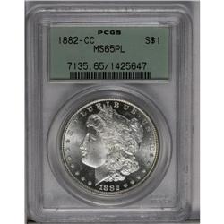 	1882-CC S$1 MS65 Prooflike PCGS. Lemon toning enriches 1882-CC