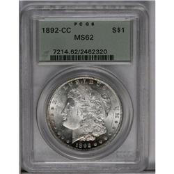 	1892-CC S$1 MS62 PCGS. A blush of rose and navy-blue t 1892-CC