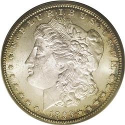 	1893-CC S$1 MS62 PCGS. Mottled forest-green and purple 1893-CC