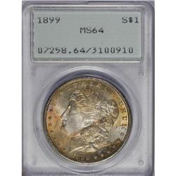 	1899 S$1 MS64 PCGS. Ruby-red, orange, and navy-blue to 1899