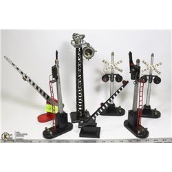SHELF OF MODEL TRAIN LIGHTS AND GATES