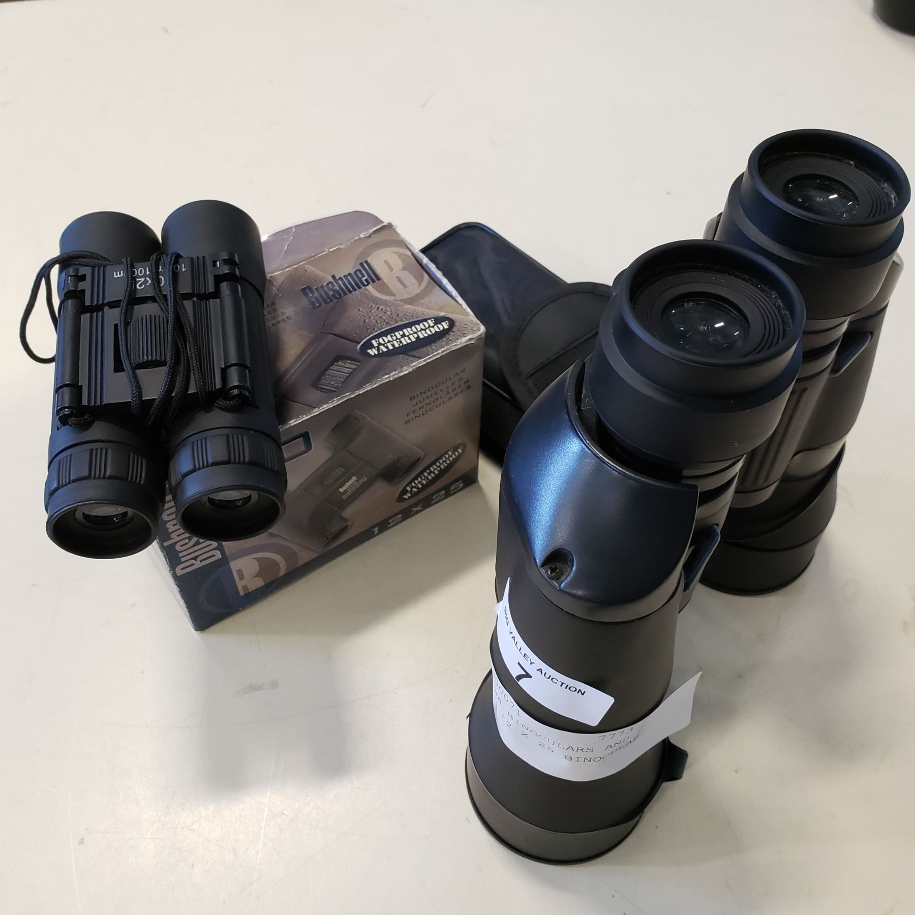 10 X 30WA BINOCULARS AND BUSHNELL 12 X 25 BINOCULARS Big Valley Auction 10 x 30wa binoculars and bushnell 12 x 25 binoculars big valley auction