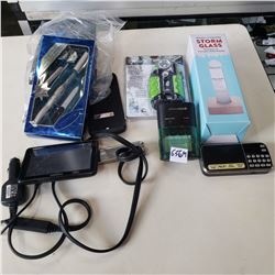 BATTERY CHARGER, GARMIN GPS, MICRO SD PLAYER, FLASHLIGHT, STORM GLASS AND MORE