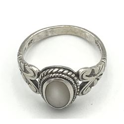 RING WITH CLEAR/ WHITE STONE MARKED “NF”
