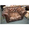 Image 1 : Two quality leather upholstered deep well tub chairs with nailhead decoration and brass castors