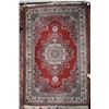 Image 1 : Turkish made wool carpet with center medallion, red background, highlights in blues, cream, taupe et