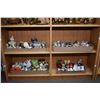 Image 1 : Two shelves of collectibles including a large selection of vintage salt and pepper shakers and colle