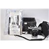 Image 1 : Olympus OM-1 35mm camera with Hoya 45mm lens, protective case and documentation including owner's ma
