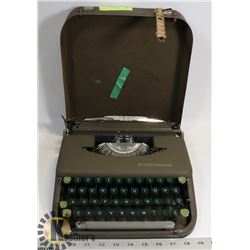SMITH CORONA TYPEWITER IN METAL CASE