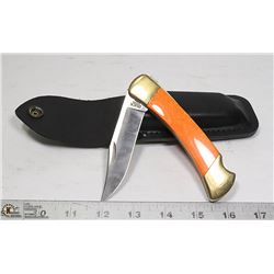 COLLECTORS BUCK KNIFE  WITH FANCY ORANGE HANDLE