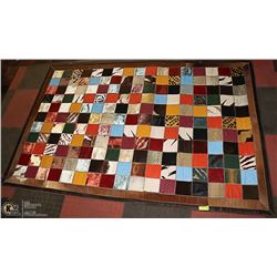 GEOMETRIC MULTI COLOURED ANIMAL PRINT RUG.