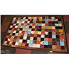 Image 1 : GEOMETRIC MULTI COLOURED ANIMAL PRINT RUG.