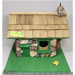 STONE AND WOOD BIRD HOUSE.