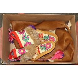 BOX OF FELT HAND MADE MOCCOSINS AND HIDE.