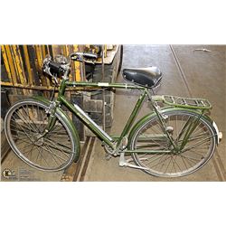 VINTAGE GREEN RALEIGH BIKE. OUTDOORS FLAT TIRES.
