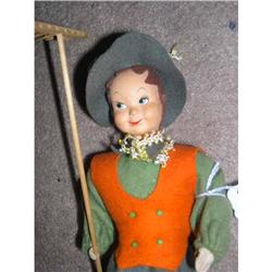 Hard plastic head felt hair boy with a rake #1009969
