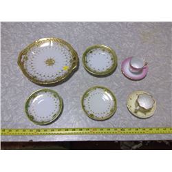 HAND-PAINTED, GOLD-COLOURED TRIM PLATES AND SAUCERS C/W MINIATURE TEACUPS