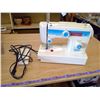 Image 2 : WHITE SEWING MACHINE AND CASE