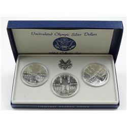 1984 OLYMPICS THREE-COIN SILVER DOLLARS