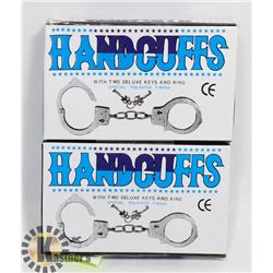 TWO NEW HANDCUFFS WITH KEYS