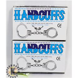 TWO NEW CANDCUFFS WITH KEYS