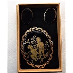 9)  VINTAGE OVAL BLACK ENAMEL WITH