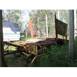 NEW HOLLAND 1033 BALE WAGON (CONSIGNED:  PHONE 780-499-0330)