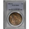 1892-CC S$1 MS63 PCGS. The yellow-orange and violet su 