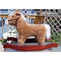 18)  PLUSH ROCKING DONKEY ON A HARDWOOD