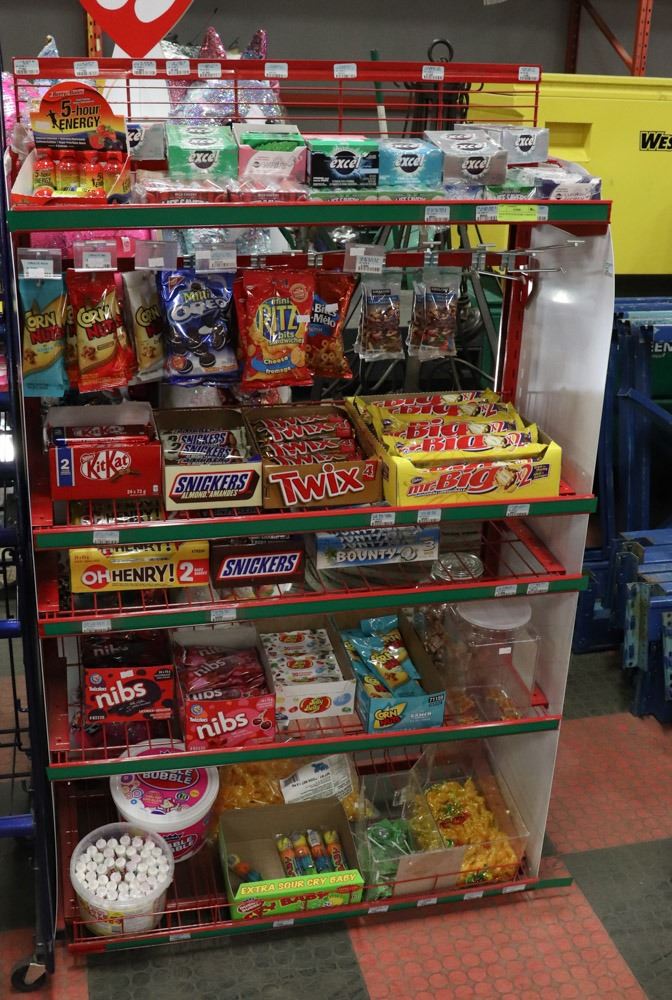 RACK WITH GUM, BARS, CORNNUTS ETC