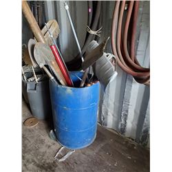 BARREL WITH SHOVELS PIPE AND MORE