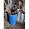 Image 1 : BARREL WITH SHOVELS PIPE AND MORE