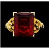 Image 1 : 10KT Yellow Gold Ladies Orangy-Red Emerald Cut Crystal Ring