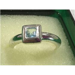 Ladies Silver princess cut topaz solitaire ring